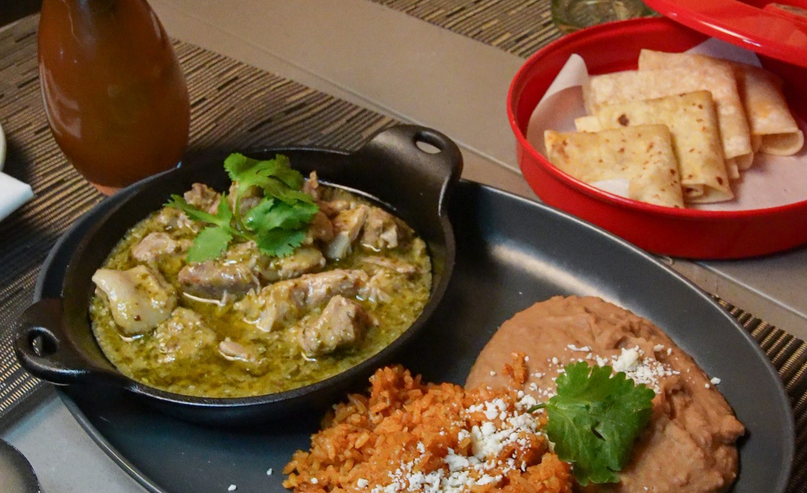 Chili verde with rice, beans and warm tortillas